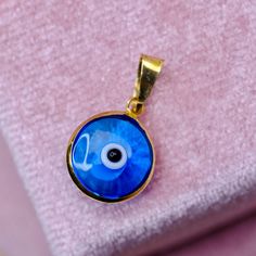 Evil Eye Pendant / Charm Metal: 14K Real Gold  Color: Yellow and Blue Height: 1.8cm Width: 1cm Gold Plated Evil Eye Jewelry, Blue Round Jewelry Gift, Round Blue Jewelry For Gift, Blue Round Jewelry For Gift, Handmade 14k Gold Blue Jewelry, Blue Pendant Jewelry With Charms, Handmade Blue 14k Gold Jewelry, Gold Plated Sapphire Jewelry, Blue Round Hallmarked Jewelry