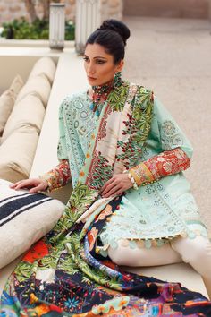 Designer Sea Green Salwar Kameez for Pakistani Eid Dress is a glorious mint canvas set off with artsy Suzani embroideries featuring botanical florals and tribal elements laid in mesmerising hues of latte, moss, and ivory enhanced with bright hues of cadmium, and lime. Shirt: Inspired by Bedouin ethos and cultural design philosophies, this exquisite design combines vivid borders in shades of bright tangerine and cyber yellow, layered with a range of embellishments from multi-hued threadwork to mi Green Salwar Kameez, Cultural Design, Heavy Dupatta, Eid Dress, Pakistani Couture, Borders Design, Beautiful Pakistani Dresses, Eid Dresses, Trendy Fashion Tops