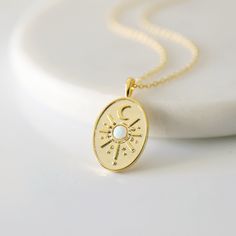 "Beautiful and lovely gold sun and moon pendant necklace. Made of gold sun, moon, and opal stone oval shape pendant with skinny gold plated brass chain. Soft and simple. Great for a gift, every day or special occasion. Your item will ship in a gift box. Please feel free to contact me if you have any questions. ♥ Chain length 14\"-20\" ♥ Pendant 1/2\" x 1\" ♥ Gold plated over brass / Opal stone ♥ Creation Time: 1 - 3 days ♥ See more Rudiana Accessories Rudiana.etsy.com" Celestial Gold Opal Necklaces, Gold Opal Celestial Necklace, Celestial Gold Opal Necklace, Sun And Moon Pendant, Necklace Sun, Necklace Moon, Sun Necklace, Necklace Layered, Celestial Necklace