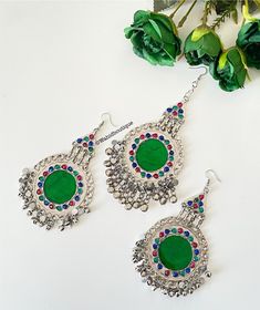 Afghan green vintage tikka and earrings set, Afghan jewellery, Afghan Fashion  Set includes: -1 pair of oversized earrings  -1 oversized tikka  Message for any enquiries Our Aim as a business is to connect Afghan women with their roots and to make anyone that purchases our jewellery feel powerful and beautiful as each and everyone of our items is handcrafted with care and love. Bohemian Green Earrings For Wedding, Green Bohemian Earrings For Wedding, Festive Green Bohemian Earrings, Bohemian Green Danglers For Party, Bohemian Green Chandbali Danglers, Green Bohemian Chandbali Danglers, Festive Green Vintage Jewelry, Heavy Green Tikka For Party, Vintage Green Earrings For Festival