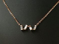 Rose gold necklace with baguette diamond. 18k rose gold. Natural diamonds. Art deco necklace. TOP QUALITY DIAMOND. 0.28 CT F COLOR. We set 4 baguette diamonds in an irregular solid gold line, in particular to create a messy effect. Delicate and Minimal necklace, perfect to be worn every day. Perfect also as wedding necklace, anniversary gift, graduation gift...Its romantic character will help make every woman special.From the menu choose the total length of the necklace, we will insert an additi Rose Gold Diamond Necklace With Baguette Diamonds, Rose Gold Baguette Cut Fine Jewelry Necklace, Elegant Rose Gold Necklace With Baguette Diamonds, Luxury Rose Gold Diamond Necklace With Baguette Diamonds, Formal Rose Gold Necklace With Baguette Diamonds, Diamond Necklace Wedding, 18k Gold Bangle, Engagement Look, Baguette Necklace