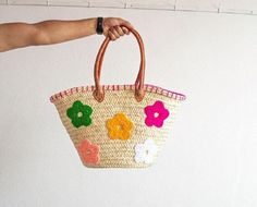 Discover the perfect blend of style and practicality with our Handwoven Straw Bag with Stars Design. Crafted with precision from natural straw and adorned with a charming floral pattern, this stylish tote is ideal for various occasions, from casual outings to market trips. A beautifully crafted bag to accompany you everywhere. Straw Bag with Flowers Design - Shopping Basket - French Market Basket - Handcrafted Moroccan Basket Whether you're looking for a chic market tote, a charming everyday bag, or a thoughtful gift, this Straw Bag with Stars Design is a perfect choice! Many of our customers also love using these bags as stylish storage or decorative accents at home. This bag is sturdy, durable, and will maintain its shape for years to come. Your bag might get slightly misshapen during sh Embroidered Natural Straw Travel Bag, Embroidered Natural Bags For Vacation, Beach Embroidered Natural Shoulder Bag, Natural Embroidered Straw Bag For Daily Use, Embroidered Bucket Bag For Beach, Handmade Multicolor Straw Bag For Spring, Multicolor Basket Bag For Spring, Embroidered Natural Bags For Beach, Multicolor Straw Bags With Leather Handles