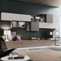 a modern living room with an entertainment center and bookcases on the wall,