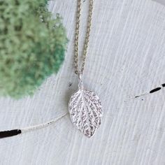 This delicate necklace features tiny fine silver leaf with beautiful and realistic details. The leaf is textured from both sides and looks gorgeous alone or layered! I sculpted the leaf from silver metal clay and then fired it to become fine silver.The leaf pendant is about 15mm (5/8"). You can buy it with or without dainty sterling silver chain. If you are buying it as a gift I would suggest 16" (40cm) or 18" (45cm) chain. If you are not sure about the length, place a string around your neck an Silver Nature-inspired Necklace For Everyday, Everyday Silver Necklace With Nature-inspired Style, Everyday Silver Nature-inspired Necklace, Everyday Nature-inspired Silver Necklace, Silver Leaf-shaped Nature-inspired Necklace, Handmade Sterling Silver Leaf-shaped Necklace, Handmade Sterling Silver Leaf Necklace, Minimalist Leaf-shaped Sterling Silver Jewelry, Minimalist Sterling Silver Leaf Jewelry