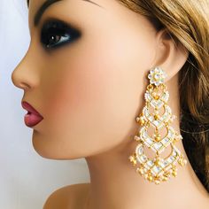 Beautiful and Unique Style Affordable Luxury traditional Bollywood Chandbali earrings with Kundan stones and Colored ruby semi precious Stones. 22k gold plated jewelry Length: Approx. 3 Inches Click here to see the complete collection of Kundan and Polki Statement Earrings at AryaFashions: https://www.etsy.com/shop/AryaFashions?section_id=25872820 Follow us on social media for new and latest designs: Facebook: www.facebook.com/shoparyafashions Pinterest: www.pinterest.com/aryafashions Instagram: Elegant Kundan Chandbali Chandelier Earrings, Kundan Multi-stone Chandbali Earrings, Dual-tone Kundan Chandbali Earrings, Luxury Kundan Bollywood Chandelier Earrings, Pink Kundan Chandelier Earrings, Kundan Chandbali, Jewelry Kundan, Kundan Jewelry, Chandbali Earrings