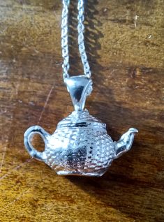 A charming fine silver teapot hangs from a sterling silver trace chain. The teapot is 2cm tall and 3cm wide. The chain is 18" long and it is fastened with a sterling silver bolt clasp. Silver Teapot, Crafter Gift, The Chain, Color Tag, Spiritual Jewelry, Silver Pendant Necklace, Fine Silver, Craft Kits, Sterling Silver Chains