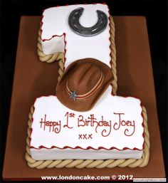 a birthday cake with a cowboy hat on it