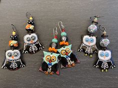 "Ahoy Matey!! These spooky little sweeties feature limited edition handmade enamel charms in the shape of little owls dressed up in their Vampire custome, complete with capes and bow ties! On top are ruffled pumpkin orange Lampwork discs and Lampwork rounds in clear with cool black scrollwork... almost looks like spiderwebs! Finished off with aqua Czech glass and blood red dots at the top. **One of a Kind, using limited edition components* Suspended from Sterling earwires. Length 2 1/2\" includi Whimsical Handmade Halloween Earrings, Whimsical Handmade Earrings For Halloween, Playful Handmade Enamel Jewelry, Quirky Handmade Halloween Jewelry, Playful Halloween Earrings As A Gift, Playful Halloween Earrings For Gifts, Playful Halloween Earrings For Gift, Owl Dress, Ahoy Matey