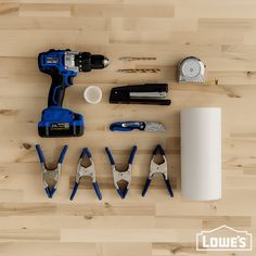 tools laid out on top of a wooden floor