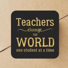 a black and gold coaster with the words teachers change the world one student at a time