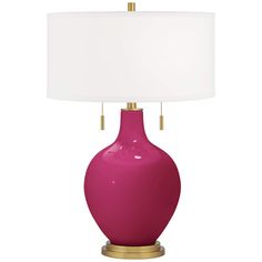 a bright pink lamp with a white shade on the bottom and gold trim around the base