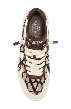 Find VALENTINO Xl One Stud Logo Toile Sneaker on Editorialist. A single Roman stud sets the fashion-forward pace for this low-top sneaker featuring a VLOGO monogram toile upper set on a chunky carved sole. Lace-up style Textile and leather upper/leather lining/rubber sole Made in Italy Men's Designer Shoes Brown Low-top Sneakers With Logo Print, Brown Sneakers With Logo Print And Round Toe, Brown Round Toe Sneakers With Logo Print, Mens Designer Shoes, Stud Set, Up Styles, Tan Brown, Valentino Garavani, Low Top