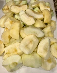 sliced bananas on a cutting board ready to be cut into wedges or cubes