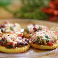 small appetizers with toppings are on a plate and ready to be eaten