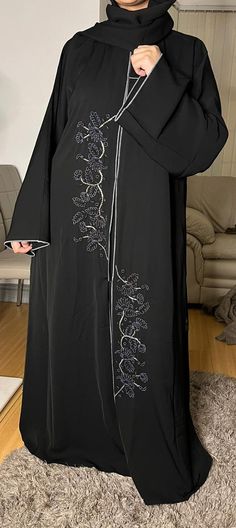 Dubai Abaya, partywear, eid special, Ramadan, gift for her, Nidaa material Abaya. Grey designs , saudi style, Arabic style, And with a bit of  creativity you can make it shine  for any ocassion. Avaiable in size 52, 54, 56,& 58 Fitted Traditional Black Abaya, Black Embroidered Abaya For Wedding, Saudi Abaya, Traditional Black V-neck Abaya, Traditional Black Embellished Abaya, Hijab Gown, Embellished Floor-length Black Abaya, Dubai Abaya, Black Abaya