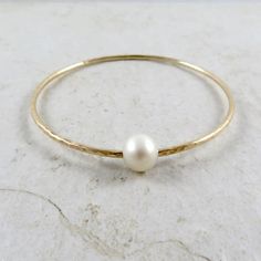 White Pearl Bangle Gold Hammered Bracelet Bridal Jewelry - Etsy Hammered Pearl Jewelry Gift, Elegant Hammered Bangle For Anniversary, Pearl Drop Round Bracelets For Anniversary, Elegant Gold Bangle With Birthstone, Elegant Hammered Round Bangle, White Hammered Wedding Jewelry, Hammered Pearl Jewelry For Wedding, Adjustable Hammered Wedding Bangle, Adjustable Hammered Bangle For Wedding