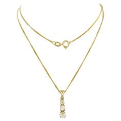 14k yellow gold necklace with pendant set with brilliant cut diamonds up to . 0.40 carat J/K VS/SI - 45 cm detailed description: the length of the necklace is 45 cm long by 0.7 mm wide the size of the pendant is 1.9 cm by 5.0 mm wide Total weight 2.9 grams set with - 3 x 2.6 mm - 3.6 mm brilliant cut diamond, up to. approximately 0.40 carats color J/K purity VS/SI necklace and pendant are in good condition hallmark present, guaranteed 14k gold Handling: If you are the highest bidder, you will re Gold Necklace With Pendant, Highest Bidder, 14k Yellow Gold Necklace, Antique Pendant, Vintage Necklaces, Gold Ring Sets, White Gold Necklaces, Modern Necklaces, Pearl Pendant Necklace