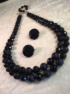 "This is a traditional and very collectible Hobé set that is just so beautiful - the necklace is features very heavy black glass beads: the smaller faceted beads shine brightly and in contrast the larger faceted beads have more of a matt finish. There are tiny glass spacers between all beads. It must be held and seen in person! The chain strung double-strand necklace measures 21-1/2\" (open at shortest strand) and has a hook clasp - the silver end bars are both marked Hobé. There is also a beade Classic Black Beaded Jewelry As Gift, Classic Onyx Jewelry For Party, Evening Jewelry With Faceted Round Beads, Costume Jewelry With Black Round Beads, Costume Jewelry With Faceted Beads For Evening, Evening Costume Jewelry With Faceted Beads, Faceted Round Jewelry For Evening, Ava Gardner, Floral Pins