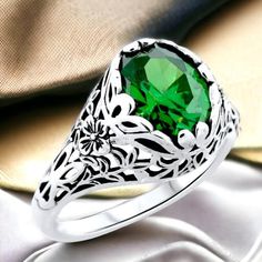 Discover the exquisite craftsmanship of our Vintage Emerald Cz Ring, meticulously designed in sterling silver with an antique finish. Featuring a captivating Emerald Cz, this ring serves as a stunning May birthstone piece, ideal for special occasions or as a thoughtful gift for her. Expertly crafted to capture timeless elegance, our ring combines beauty and durability, making it an exceptional addition to any jewelry collection. Bring home this elegant piece, symbolizing sophistication and heritage. Excellent Condition, Satisfaction Guaranteed! Silver Filigree Ring With Stone Setting For Formal Occasions, Exquisite Silver Sterling Silver Emerald Ring, Exquisite Silver Sterling Emerald Ring, Exquisite Silver Emerald Ring In Sterling Silver, Silver Emerald Ring With Cubic Zirconia, Filigree Ring For May Birthstone Gift, Silver Filigree Ring For Formal Occasion, May Birthstone Filigree Ring Gift, Intricate Emerald Anniversary Ring