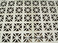 an intricately designed pattern on the side of a building in india, made out of white wood