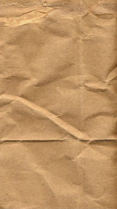 a piece of brown paper that has been torn in half