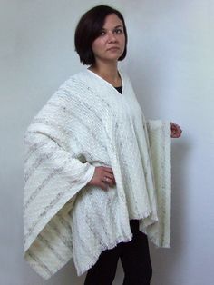 This poncho is hand woven with combination of yarns : pure wool,wool with some acrylic,wool with viscose, in natural color and tweed. It is very soft and nice to wear. It will warm you during the cold days. You can wear in two ways : boat - neck or v - neck.Size ( boat - neck ) : from shoulder to waist 63 cm / 24,8 in, arm : 48 cm / 18.9 in plus 2 cm / 0.8 in for fringeSize ( v-neck) :  from shoulder to waist 65 cm / 25,6 in plus 2 cm / 0.8 in for fringe , arm : 63 cm / 24,8 inThe model is 170 c Handmade Shawl Cape For Winter, Handwoven Winter Shawl Cape, Handmade Alpaca Poncho Shawl, Handwoven Shawl Cape For Winter, Handmade Alpaca Shawl Poncho, Handmade Oversized Winter Poncho, Winter Handmade Oversized Poncho, Handmade Winter Poncho Cape, Fall Handwoven Cape Shawl