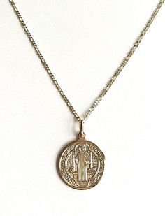 "18K GOLD FILLED SAINT BENEDICT NECKLACE 20\" LONG...FOR GOOD LUCK ,PROSPERITY AND PROTECTION. PENDANT : 25 mm 18K GOLD FILLED CADENA DE SAN BENITO 20\" LARGO ..PARA PROSPERIDAD, BUENA SUERTE Y PROTECCION. DIJE: 25 mm" Gold Sterling Silver Chain Necklace Nickel Free, Gold Engraved Charm Necklace For Good Luck, Nickel-free Yellow Gold Medallion Necklace, Nickel-free Gold-plated Yellow Gold Necklace, Nickel-free Yellow Gold-plated Necklace, Nickel-free Yellow Gold Plated Necklace, Gold Round Charm Necklaces For Good Luck, Gold Good Luck Charm Necklace Nickel Free, Gold Nickel-free Charm Necklaces For Good Luck