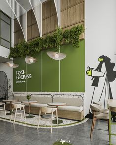 the interior of a restaurant with green and white walls