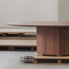 a wooden table sitting on top of a hard wood floor