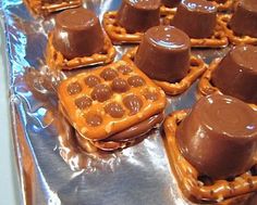 chocolate covered pretzels on top of aluminum foil in the shape of waffles