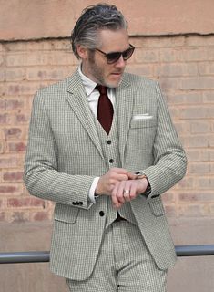 The semblance of a person sometimes is identified by the fashion one chooses to be different from everyone else. Tailored with wool, our Houndstooth Light Gray Tweed Suit is a piece with a houndstooth pattern which is a unique design that looks like a hound dog's tooth and gives warmth at every wear. In addition, the light gray color will emanate your personality giving positive vibes. So include this excellently designed suit in your closet, which will create a trend that will never go out of style.  Look Includes   Houndstooth Light Gray Tweed Fabric  Two Button Jacket Style  Notch Lapel  Real Horn Royal Buttons  Single Vent  Three Cuff Buttons  Two Welted Back Pockets on Trousers    Click 'Customize Now' to modify the look if needed.   Lining: Viscose; Dry Clean. Tailored Houndstooth Tweed Jacket For Business, Business Tweed Jacket With Houndstooth Pattern And Suit Collar, Formal Houndstooth Tweed Jacket With Notch Lapel, Notch Lapel Tweed Jacket With Houndstooth Pattern, Tailored Tweed Blazer With Houndstooth Pattern, Tweed Houndstooth Blazer With Notch Lapel, Tweed Jacket With Houndstooth Pattern For Business Casual, Tailored Tweed Jacket With Houndstooth Pattern For Business Casual, Wool Houndstooth Suit With Notch Lapel