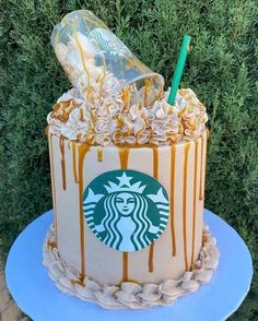 a starbucks cake with caramel drizzles and whipped cream on the top