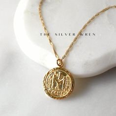 This gold pendant necklace is chic and stylish! A gold coin pendant graces a sparkling twist gold chain.  Sure to be your favorite, this go with your favorite white tee or dressed too! DETAILS  *18kt gold over sterling silver coin pendant 22mm  *A 14kt gold filled dainty singapore twist chain  LENGTH  *Please select from the drop down selection. *The standard length is normally 18". *Model is wearing 18" in Photos. Styled with our Pearl Initial Necklace for layering inspiration.  HOW TO PERSONAL Layering Inspiration, Chain Gold Necklace, Gold Coin Pendant, Necklace Gold Chain, Gifts For Her Birthday, Pendant Necklace Gold, Gold Coin, Women Gifts, Silver Coin