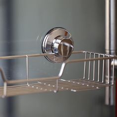 a close up of a metal shelf with a towel rack on it's side