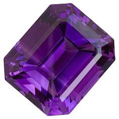 PRODUCT INFORMATION: Faceted Purple Amethyst Weight: 15.60 Carats Dimension: 16x13.6x10.6 Mm Shape: Emerald Origin: Brazil Color: Deep Purple Treatment: None DESCRIPTION: This stunning 15.60 carats faceted purple amethyst is a perfect centerpiece for a necklace, exuding elegance and sophistication. Cut into an exquisite emerald shape, the gemstone showcases sharp facets that enhance its deep, royal purple hue, allowing the stone to reflect light beautifully from every angle. Sourced from Brazil, Brazil Colors, Royal Purple, Vintage Inspired Design, Fine Jewelry Collection, Purple Hues, Art Furniture, Amethyst Gemstone, Purple Amethyst, Deep Purple