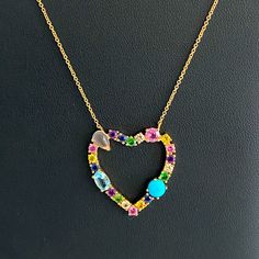 14kt Gold Diamond & Multi-Gemstone Open Heart Necklace Beautiful Multi-Shaped Gemstones Including Diamonds, Sapphires, Rubies, Emeralds, Moonstone, Aquamarine, And Turquoise Are Prong Set In 14kt Gold. On An Adjustable 15-17 Inch 14kt Gold Chain With Lobster Clasp Stamped 14kt - Heart Is 1 X 1 Inches Yellow Gold Multi-stone Jewelry For Valentine's Day, Valentine's Day Yellow Gold Multi-stone Jewelry, Fine Jewelry Heart Shaped Multi-stone, Fine Multi-stone Heart-shaped Jewelry, Yellow Gold Gemstone Heart Necklace, 14k Yellow Gold Heart Necklace With Gemstone, Fine Jewelry Multi-stone For Valentine's Day, Yellow Gold Heart Cut Multi-stone Jewelry, Yellow Gold Heart Necklace With Gemstone