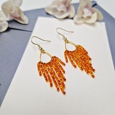 Beautiful beaded fringe earrings. Made with high quality glass beads. They are perfect for special occasion and everyday use. They will transform your daily outfit into something special and unique. They are perfect for a gift. 2.4 inch (6 cm) long silver plated or gold plated ear wires glass beads high quality thread  other colours available, please send me a message if you can't find colour that you need Thank you for visiting my shop ! Orange Fringe Earrings As A Gift, Orange Fringe Beaded Earrings For Gift, Orange Handwoven Dangle Beaded Earrings, Orange Beaded Fringe Dangle Earrings, Orange Faceted Beads Dangle Earrings, Find Color, Beaded Fringe, Fringe Earrings, Seed Bead Earrings