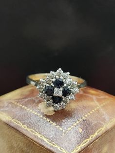 This beautiful vintage ring is hallmarked London 1986 featuring Sparkling sapphire and cubic zirconia gemstones set in a cluster with 9ct yellow gold band.  UK size - R1/2 US size - 8.75 Message me any questions Beautiful Rings Vintage, Etsy Gold Ring, Vintage London, Yellow Gold Ring, Vintage Ring, Gold Band, Design Floral, Yellow Gold Rings, Gold Bands