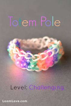 an image of a ring made out of loom love's rainbows and white beads