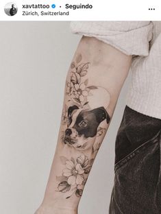 a person with a dog tattoo on their arm