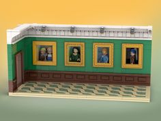 a lego model of an art gallery with paintings on the wall and people's faces in frames