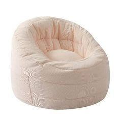 a small round dog bed with pink fabric on the bottom, and a white background