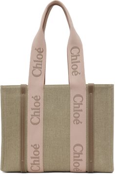 Structured linen canvas tote in beige. · Buffed calfskin trim throughout · Logo-woven shoulder straps · Open throat · Patch pocket at interior · Linen twill lining · H11 x W14 x D4 Supplier color: Blushy beige Medium Tote Bag, Small Tote Bag, Cream Tops, Linen Canvas, Mini Tote Bag, Medium Tote, Small Tote, Classic Logo, Mini Tote