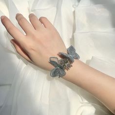 Say goodbye to boring bridesmaid gifts! Our Butterfly Wrist Corsage is the perfect way to show your appreciation while adding a touch of flair to your special day. With its jewel-toned butterfly design and traditional Korean accents, you'll be ready to strut your stuff on the aisle in style! Handmade Jewlery, Floral Bracelet, Wrist Corsage, Traditional Korean, Romantic Style, Butterfly Design, Dress Size Chart, Dress Size Chart Women, Bridal Shoes