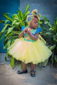 Gorgeous and fun dress made with a Kente African Print on the bodice and then attached to yellow strips veil tutu skirt. The dress also features a square yoke and a zipper on the back for easy wear. Your girl will feel like a little African princess for sure. The dress is fully lined. Each fabric piece used for the dress was hand cut and later assembled on a sewing machine.  All seams are professionally and carefully sewn and serged for reinforcement. Dress fabric: 100% Cotton  Veil: 100% Polyes Green Fitted Princess Dress With Short Sleeves, Fitted Yellow Princess Dress For Dress-up, Yellow Fitted Princess Dress For Dress-up, Yellow Princess Dress For Dress-up, Fitted Yellow Princess Dress For Summer, Multicolor Ruffled Dress For Costume, Fitted Multicolor Tutu Dress With Ruffles, Fitted Multicolor Princess Dress For Summer, Playful Fitted Dress For Dress-up Occasions