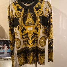 Worn Once In Perfect Condition Versace Metallic Throughout Black W/Gold And White Pullover Gold Long Sleeve Tops With Baroque Print, Gold Long Sleeve Top With Baroque Print, Long Sleeve Gold Tops With Baroque Print, Luxury Gold Long Sleeve Top, Luxury Long Sleeve Gold Top, Elegant Gold Crew Neck Top, Luxury Long Sleeve Tops With Baroque Print, Luxury Winter Party Tops, Designer Party Tops For Winter