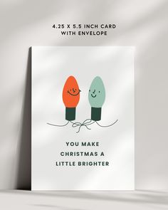 a christmas card with two lights and the words you make christmas a little brighter on it