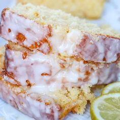 two slices of lemon cake with icing and sugar on top, next to a slice of lime