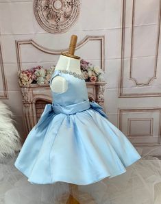 Fabulous Baby Girl formal blue dress. This is one of a kind princess dress.This gorgeous Cinderella-like dress is one of a kind. Beautifully crafted with decorating crystal around neckline and bows (front and back bows are detachable). Fully lined. Impressive attention to detail. Perfect gift for your little princess!! Features:Made of soft, comfortable and high quality material, Satin and Tulle. This party dress features three layers for an extra puffy look and it is yet very conformable. Dress Elegant Blue Princess Dress For Baptism, Elegant Blue Dress For Birthday, Elegant Blue Birthday Dress, Elegant Blue Princess Dress With Bow, Princess Style Pageant Dress With Satin Bow, Elegant Light Blue Princess Dress For Pageant, Elegant Light Blue Princess Dress For Birthday, Elegant Light Blue Dress For Birthday, Blue Princess Dress With Bow