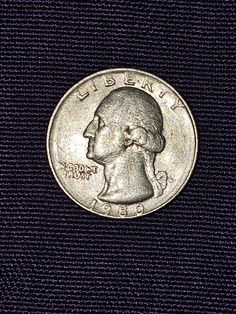 an image of a coin with the face of george washington on it's side